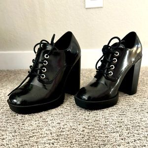 Black platform lace up boots.